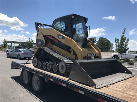 loading a skid steer onto a flat bed|how to tie skid steer loader.